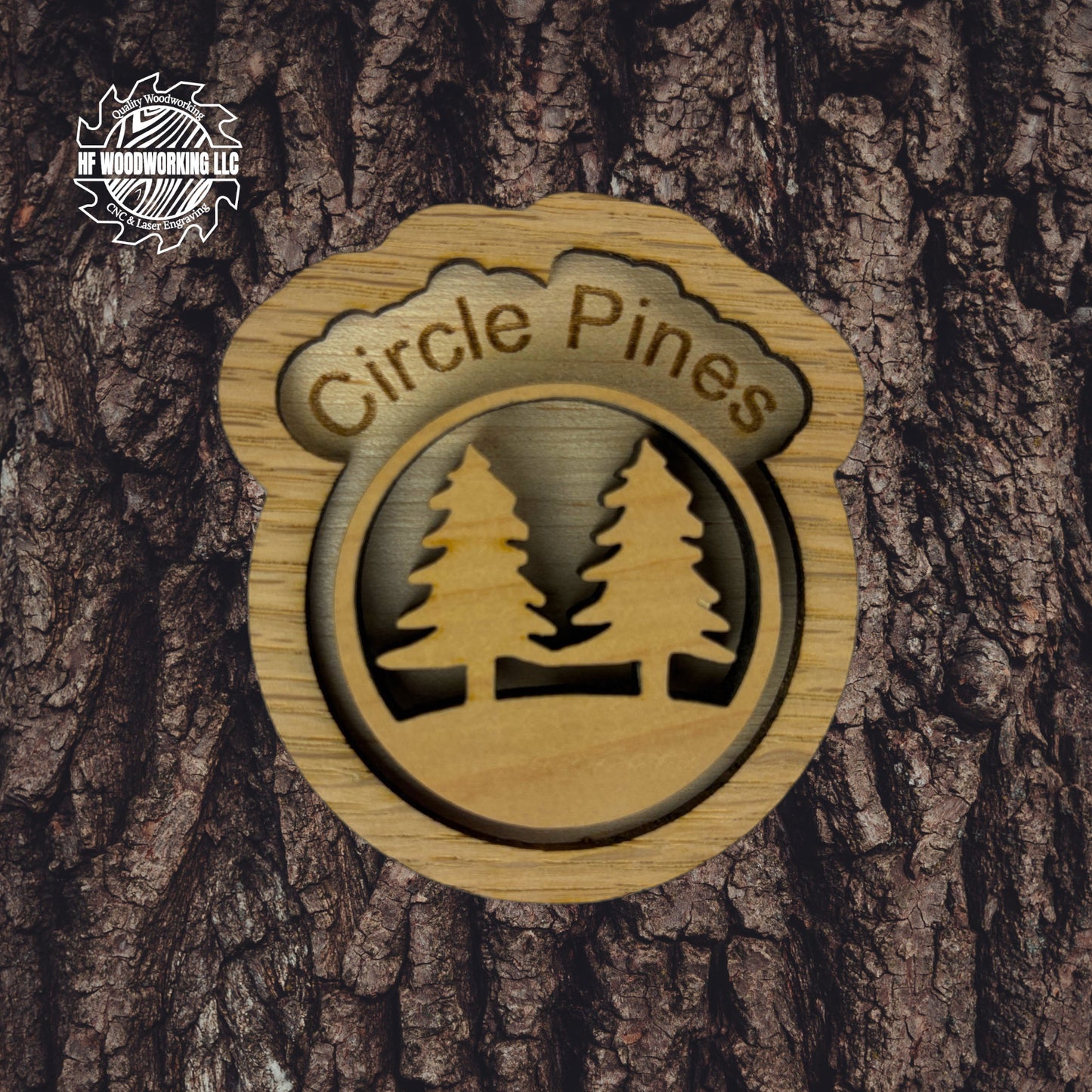 Wooden plaque with 'Circle Pines' engraving and tree design on a textured background